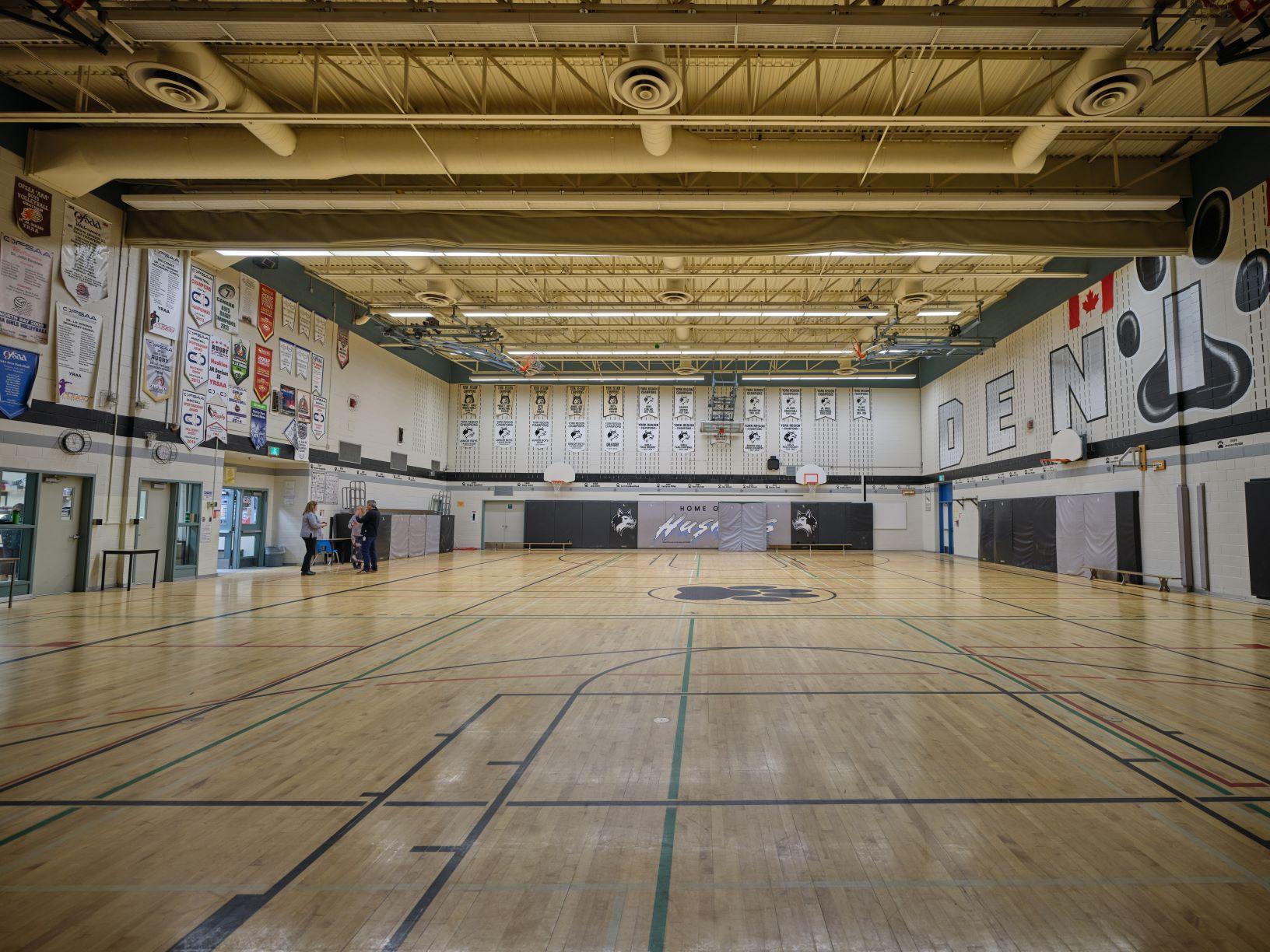 Large gymnasium with banners hanging on the walls